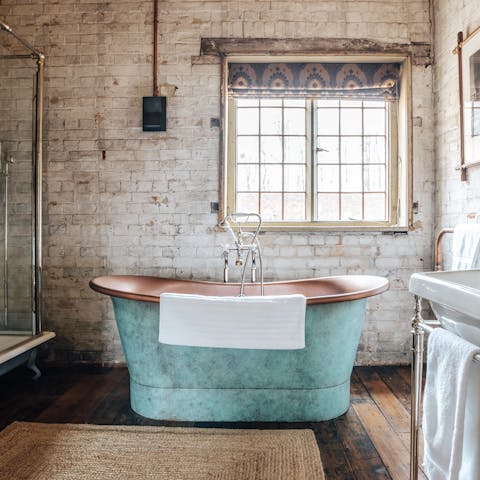 Lie back and relax in the copper roll-top bath