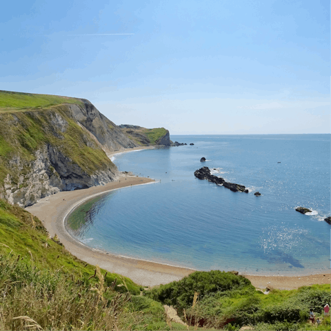 Go fossil hunting or sunbathe on the beautiful beaches of the Jurassic Coast – half an hour away