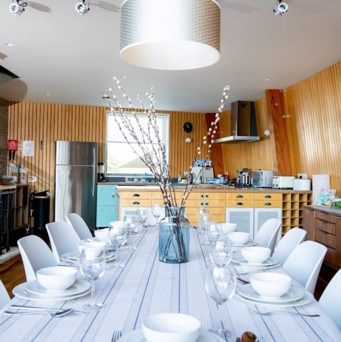 Gather your ensemble for a feast around the large dining table