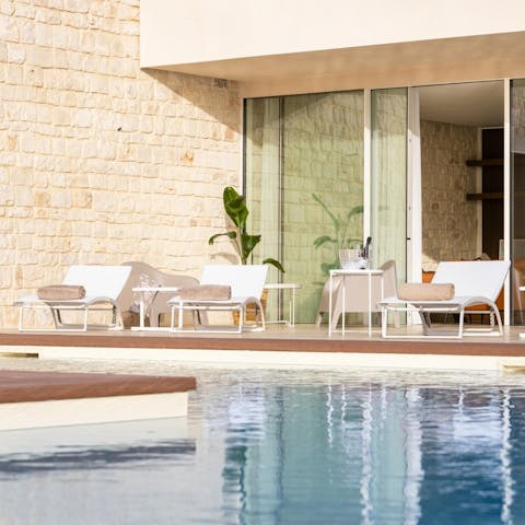Can some sun by the swimming pool