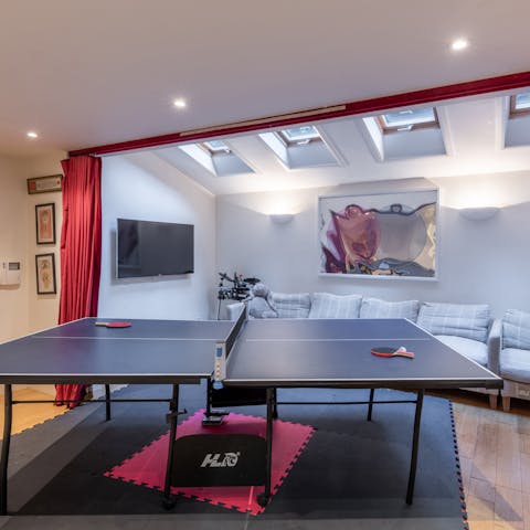 Get a game of ping pong going in the basement playroom