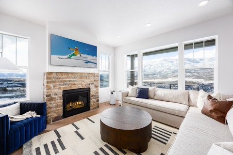 Warm up by the fire as snow-capped peaks fill the windows