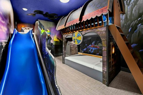 Slide into bedtime in a fully themed dragon adventure bedroom