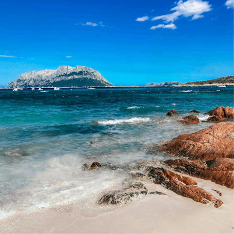 Swim in the crisp waters of Cala Benirrás, 6.5km away