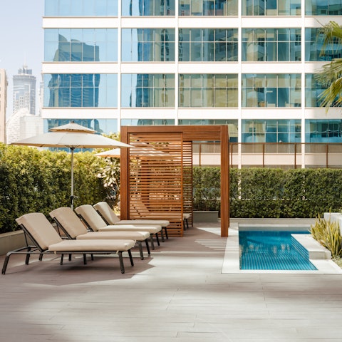 Soak up the soft morning rays before diving into the cooling waters of the pool