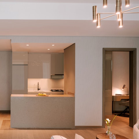 Whip up light bites to share in your sleek natural stone kitchen