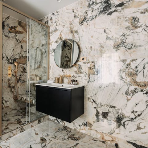 Feel anew beneath the luxurious rainfall shower