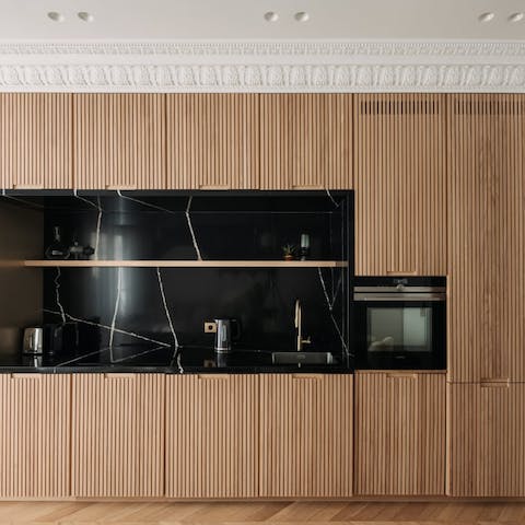 Fire up the coffee pod machine in the sleek, modern kitchen