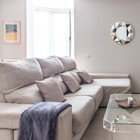 Stretch out on the plush couch after a day of exploring the city