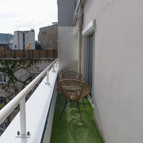 Sip a glass of wine on the small balcony at sundown