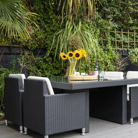 Dine alfresco or sip wine on the decking in the outdoor lounge