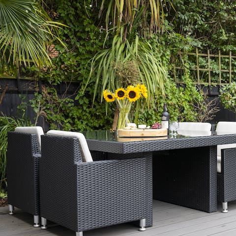 Dine alfresco or sip wine on the decking in the outdoor lounge