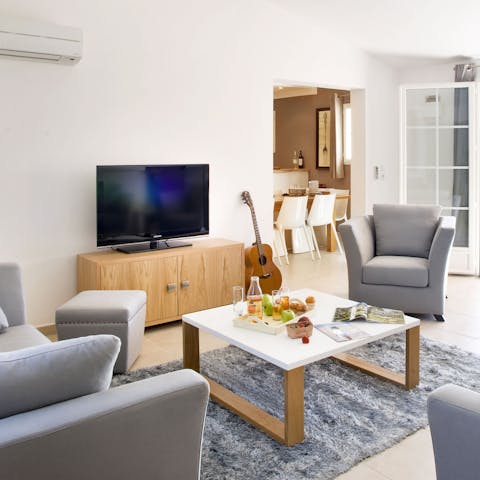 Strum the guitar or have a family movie night in the living area