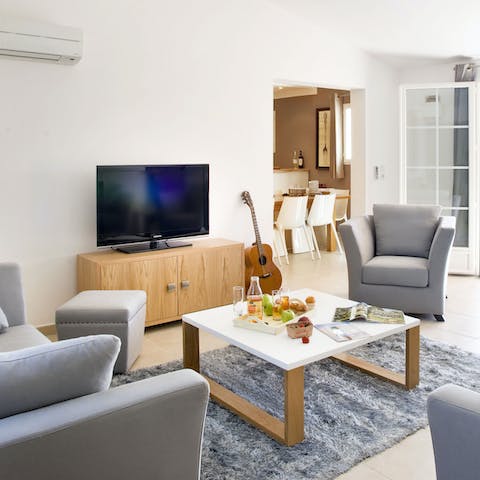 Strum the guitar or have a family movie night in the living area