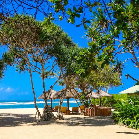 Connect with nature in Canggu, home to emerald green rice fields and volcanic sand beaches