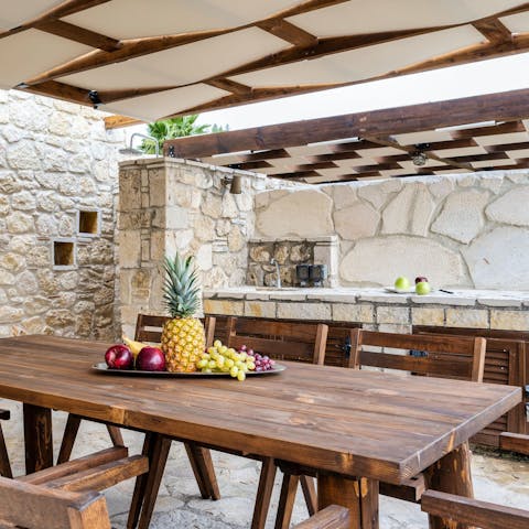 Dine alfresco on souvlaki prepared in the outdoor kitchen