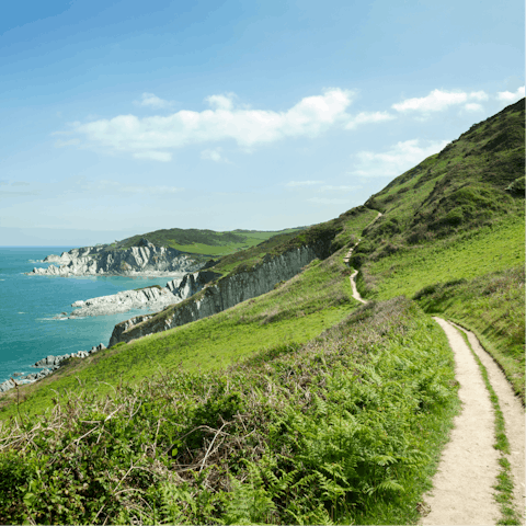 Explore Cornwall's scenic coastal trails, a ten-minute drive away