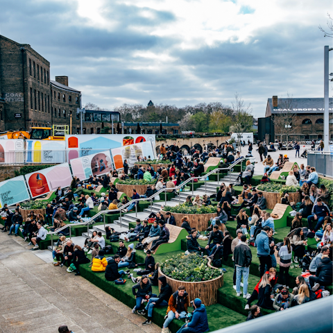 Sit by the canal in Granary Square, a short walk away