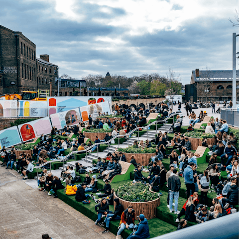 Sit by the canal in Granary Square, a short walk away
