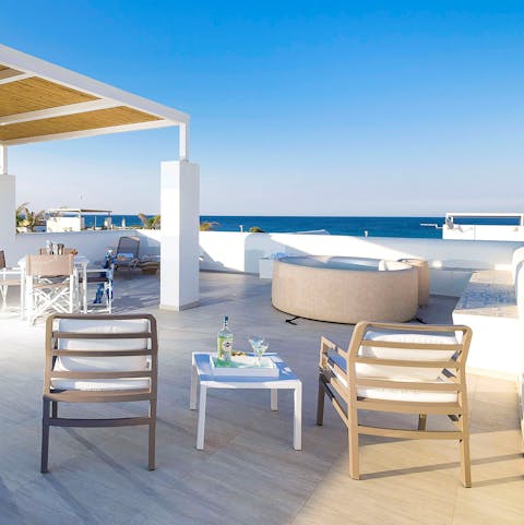 Head onto the rooftop terrace to enjoy the hot tub with a view