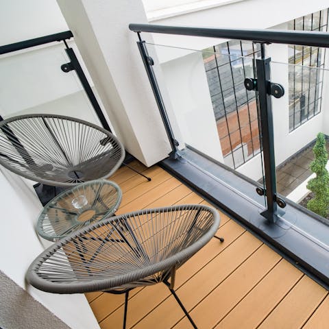 Sit out on the home's balcony during golden hour