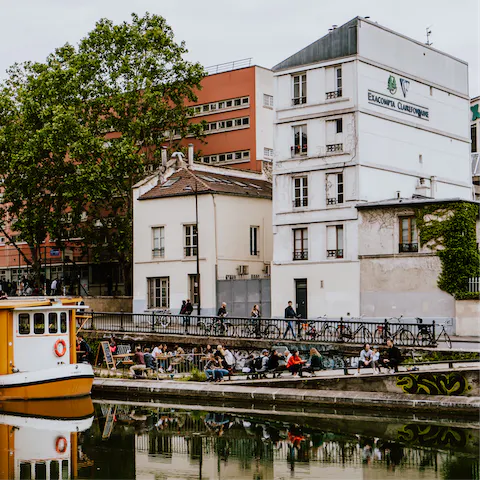 Head to the Canal Saint-Martin for waterside drinking and dining, ten minutes away