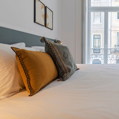 Wake up to sunlight streaming through the French windows, each adorned with Juliet balconies