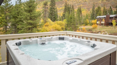 Unwind in the hot tub as natural beauty fills the hillside