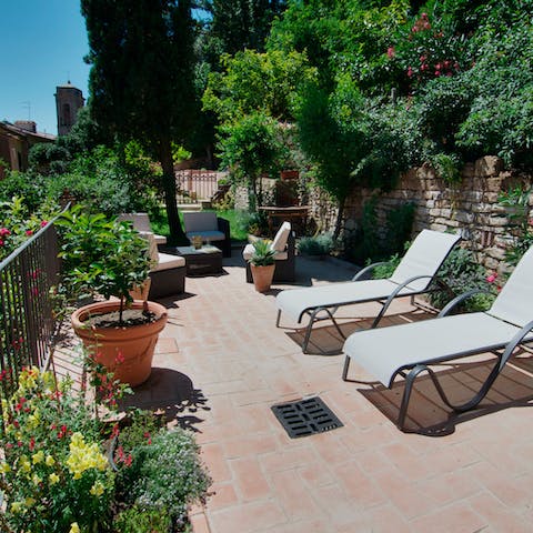 Enjoy balmy sunset drinks in the idyllic setting of the garden