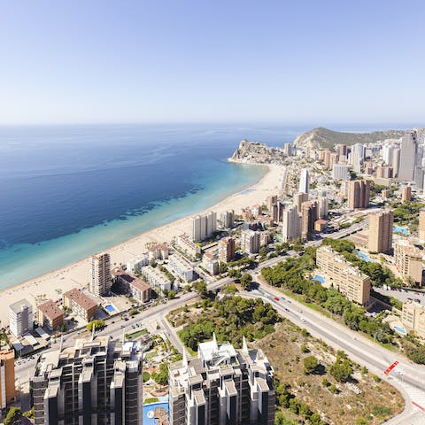 Saunter 150 metres to the Playa de Poniente, backed by a busy promenade