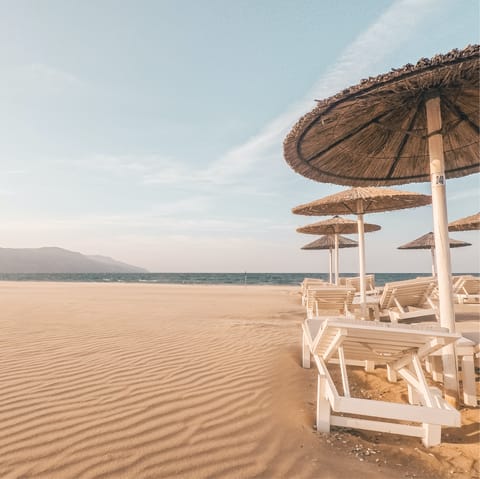 Sink your feet into the golden sand of nearby Ammoudara beach