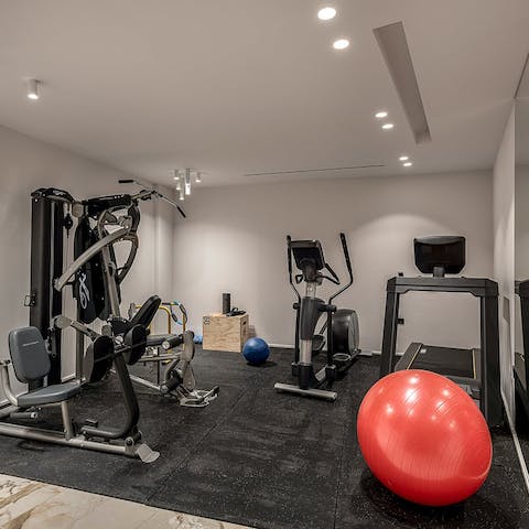 Stay on top of your fitness routine with a workout in the private gym
