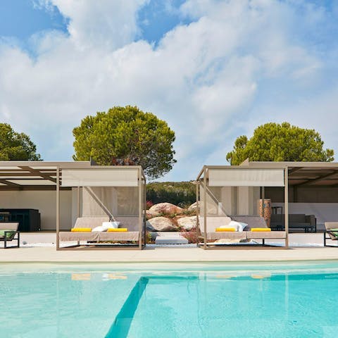 Bag one of the double day beds by the poolside