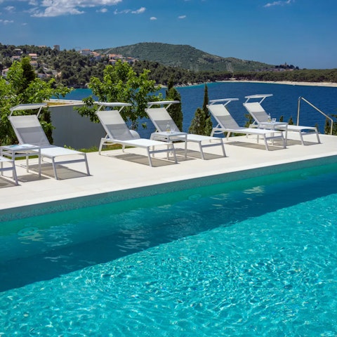 Relax in the Croatian sun by the shared infinity pool