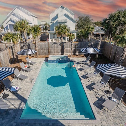 Lounge around the palm-fringed pool