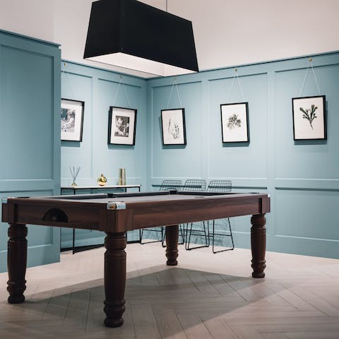 Shoot some pool in the communal lounge