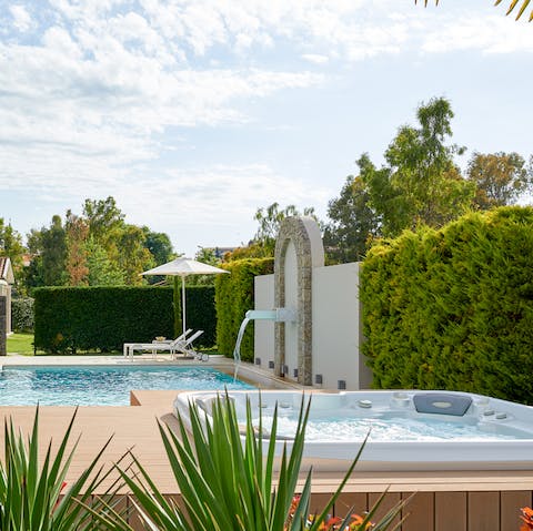 Relax into the jacuzzi with the trickling sound of the waterfall in the background