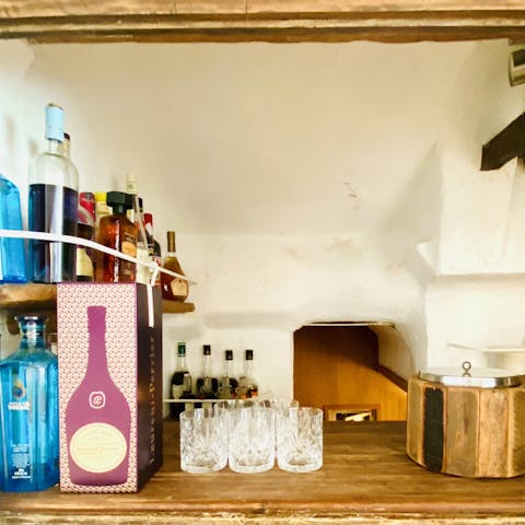 Mix up a few French martinis at the rustic bar inside