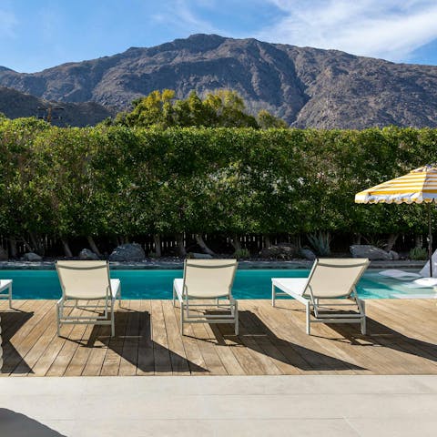 Savour the mountain scenery from your poolside perch