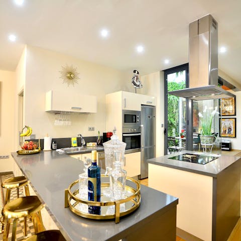 Shake up an Agua de Sevilla and prepare some tapas in the sleek kitchen
