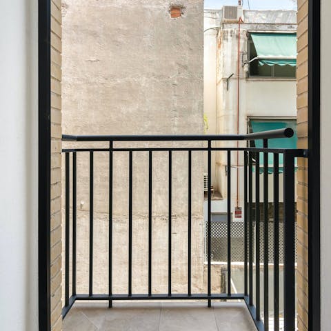 Sip coffee on the balcony as you watch the street below come to life