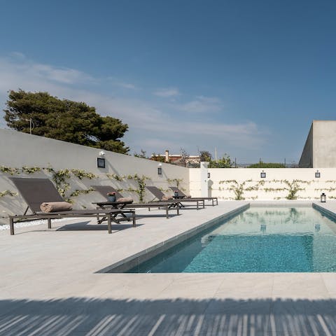 Let blissful hours roll by while you relax by the pool, soaking up the sun, and occasionally taking a dip to cool off