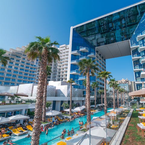 Bask in the sunshine around the pool before cooling off with a refreshing dip