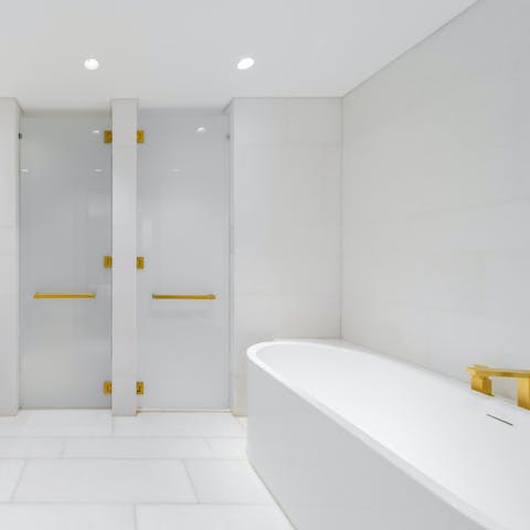 Treat yourself to an indulgent soak in the plush bathtub