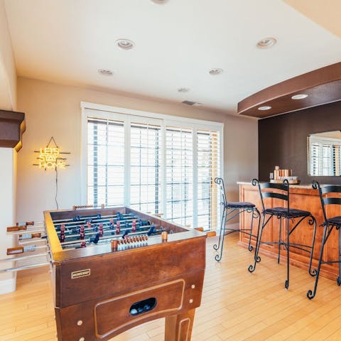 Play a friendly game of foosball in the home bar