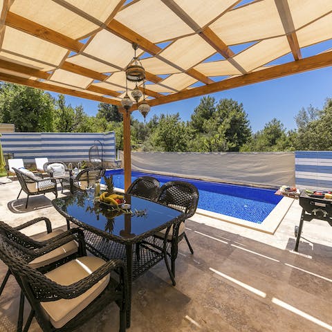 Enjoy alfresco poolside dining