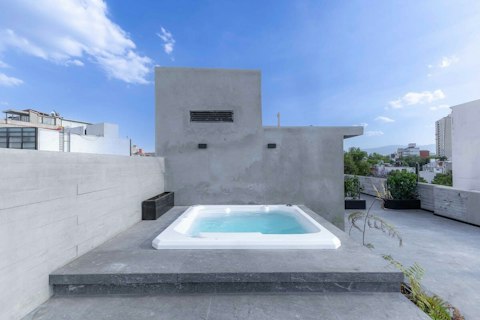 Slip into the communal rooftop hot tub beneath open Mexico City skies