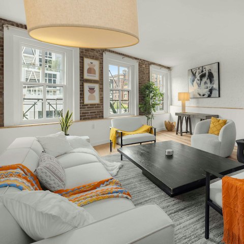 Unwind in between sightseeing by the tall windows of the loft