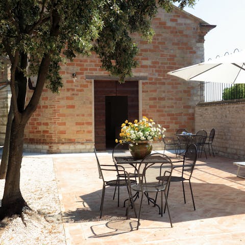Dine alfresco under the shade of the trees