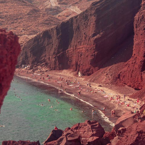 Visit Kokkini Beach, known for its dramatic red scenery